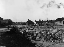 Sprängning pågår för framdragningen av Rosenlundsgatan. Vy norrut från Maria Prästgårdsgata mellan kvarteren Piskan och Grimman